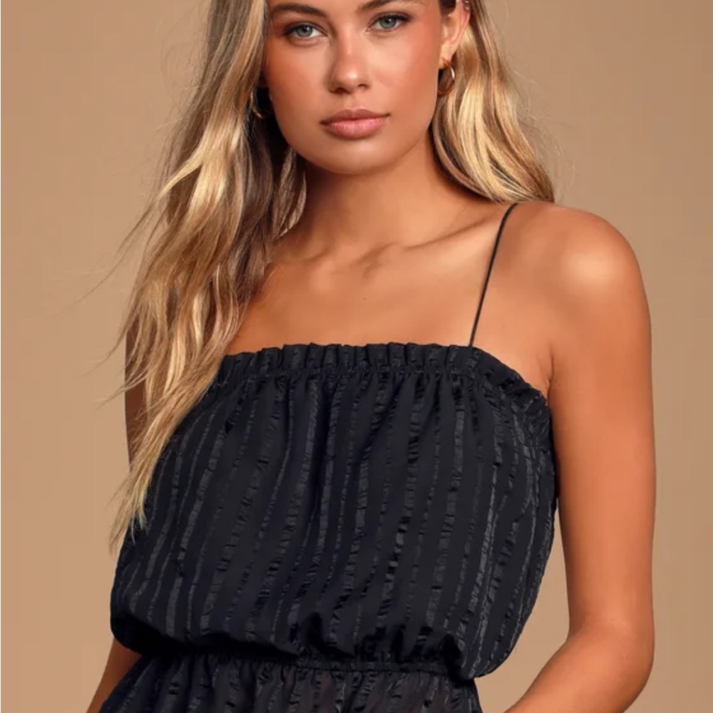 Lulus spaghetti strap blacktank. Super cute with jeans. Too small for me.